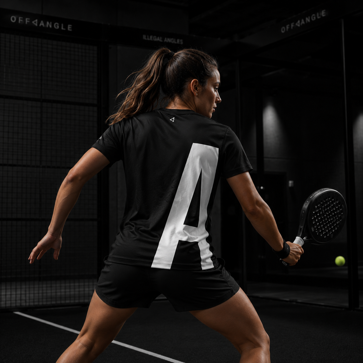 OFF<ANGLE Play Different Tee Black performance padel shirt from the ILLEGAL ANGLES collection