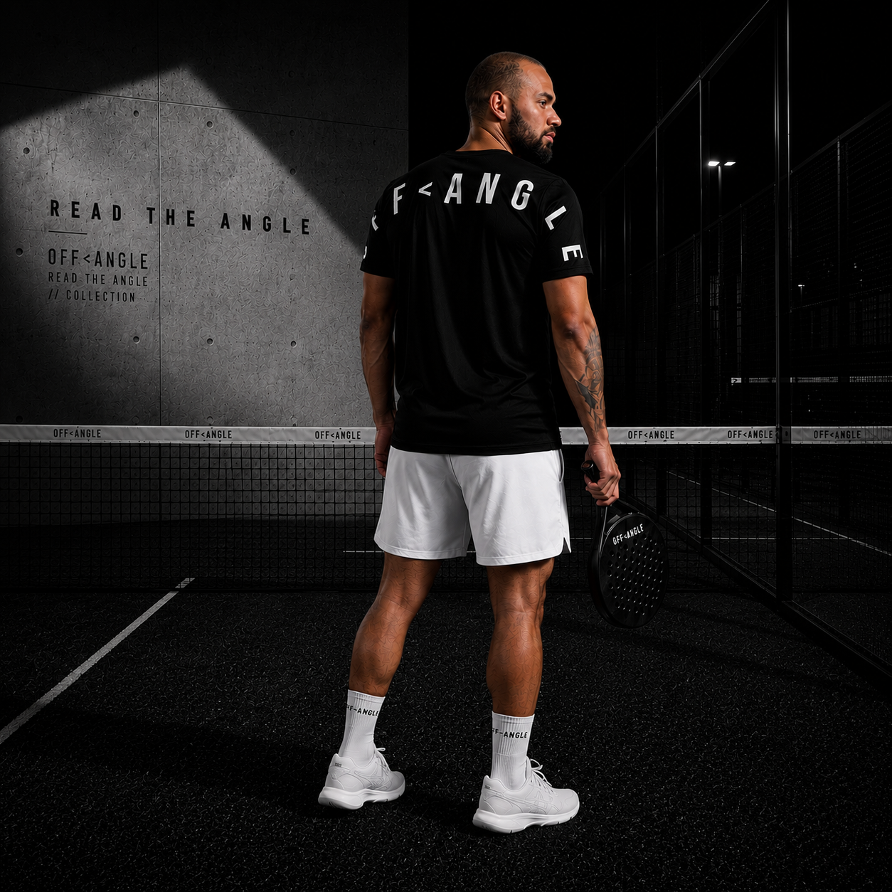OFF<ANGLE Transition Tee Black performance padel shirt from the READ THE ANGLE collection
